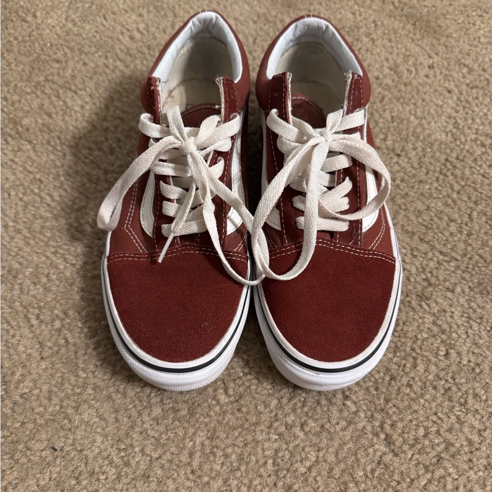 Woman’s maroon vans